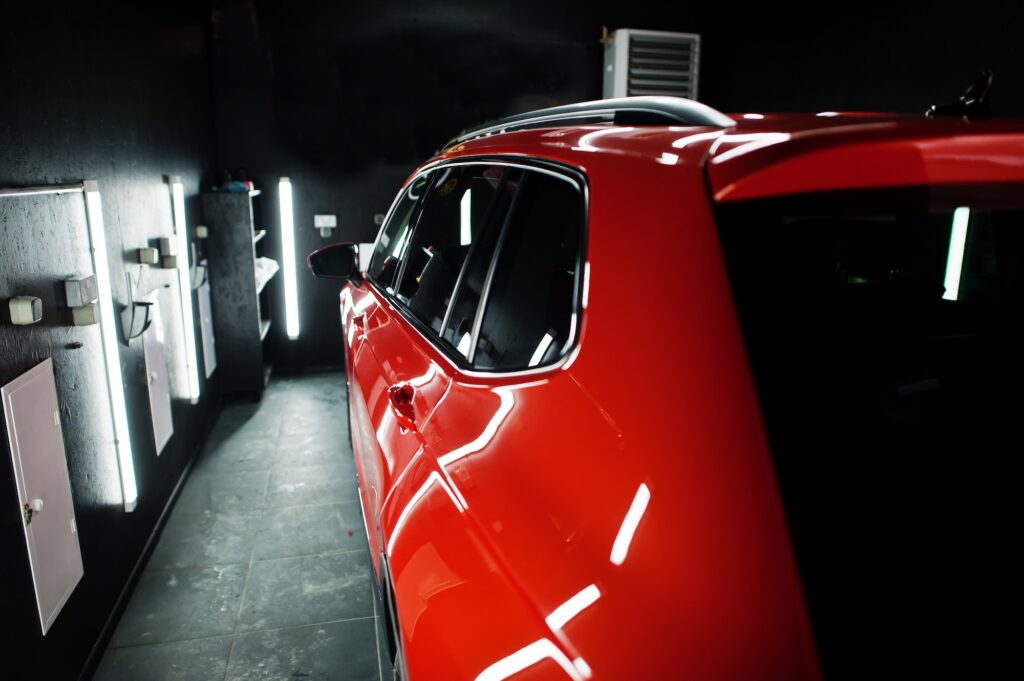 Nice and new orange sport suv car in modern garage.
